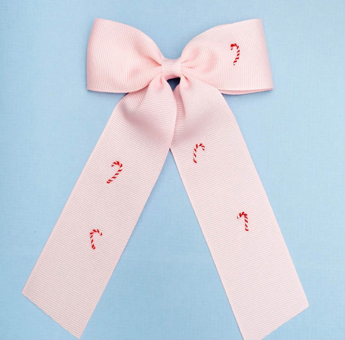 Hand-embroidered candy cane bow